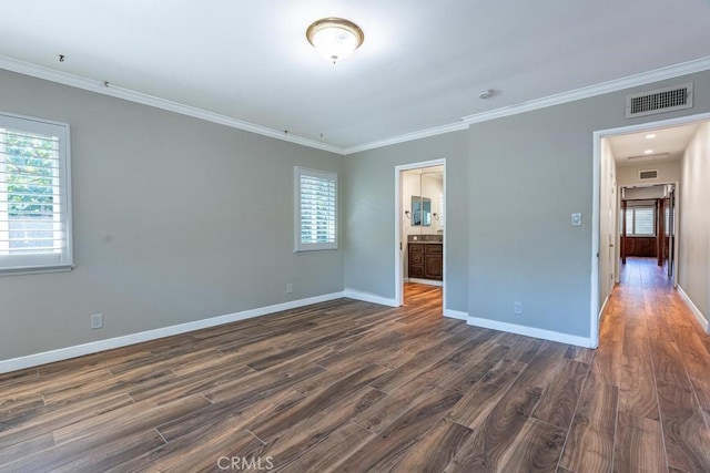 unfurnished room with ornamental molding and dark hardwood / wood-style floors