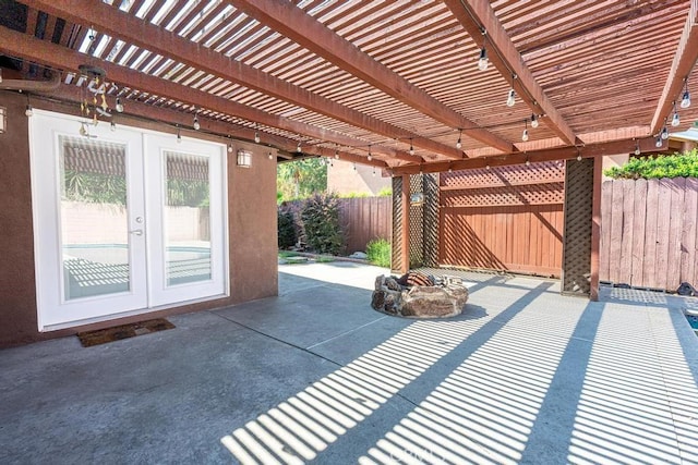 view of patio / terrace featuring a pergola and french doors