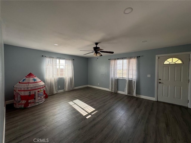 entryway featuring ceiling fan and dark hardwood / wood-style floors