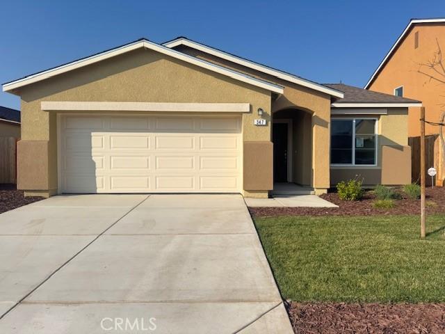 ranch-style house with a front lawn and a garage