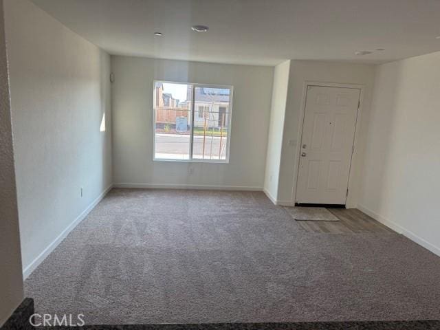 unfurnished room with carpet floors