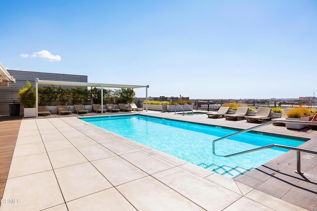 view of swimming pool with a patio