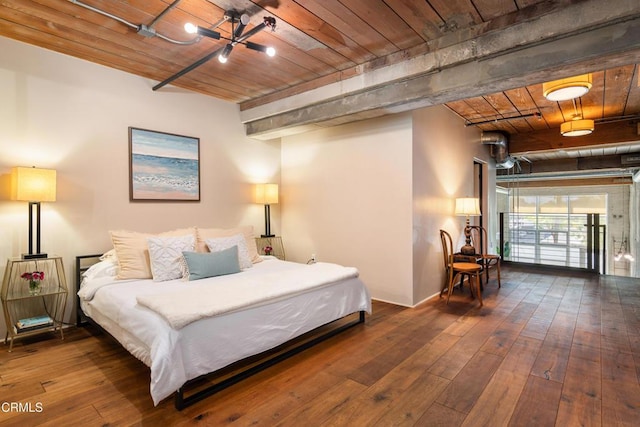 bedroom with a chandelier, dark wood-type flooring, and wooden ceiling