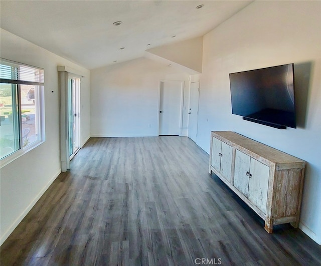 56133 Jesse Rd, Landers, CA 92285 - unfurnished living room featuring lofted ceiling, dark wood finished floors, and baseboards