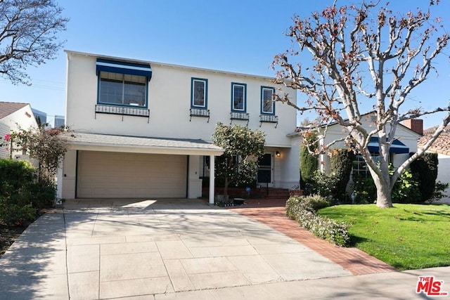 view of front facade featuring a garage and a front yard