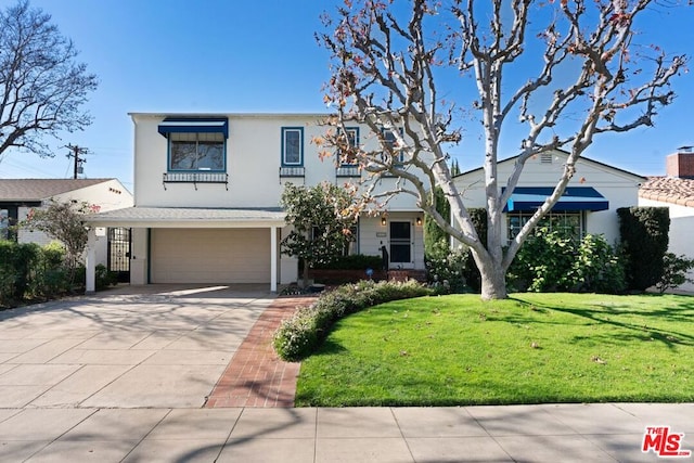 view of front facade featuring a front yard and a garage