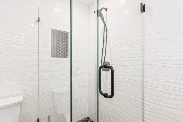 bathroom featuring an enclosed shower