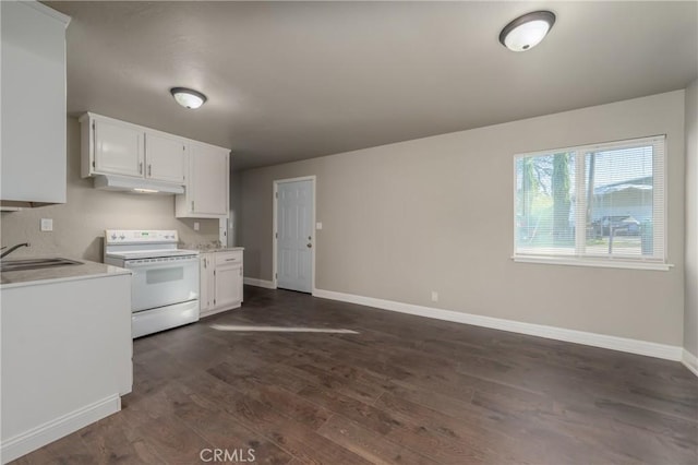 kitchen with electric stove, white cabinets, dark hardwood / wood-style flooring, and sink