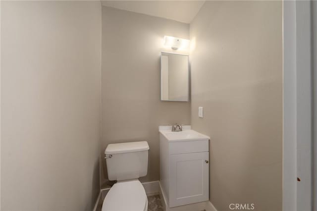 bathroom with toilet and vanity