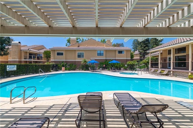 view of pool featuring a community hot tub