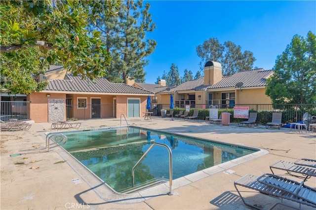 view of swimming pool with a patio area