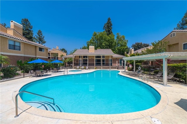 view of pool featuring a pergola, a patio area, and a hot tub