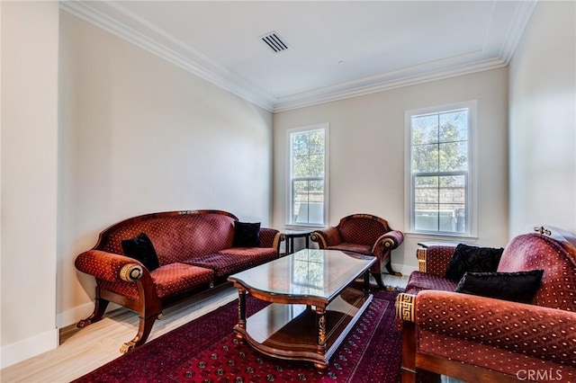 living room featuring hardwood / wood-style flooring and crown molding