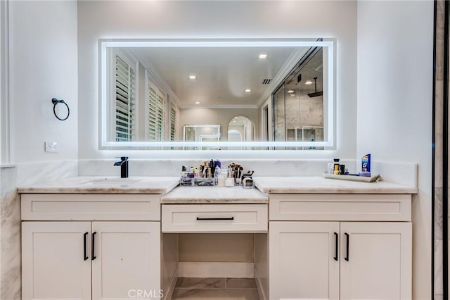 bathroom with an enclosed shower and vanity