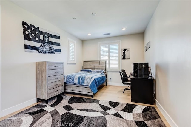 bedroom with light hardwood / wood-style flooring