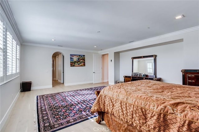 bedroom with crown molding and light hardwood / wood-style flooring