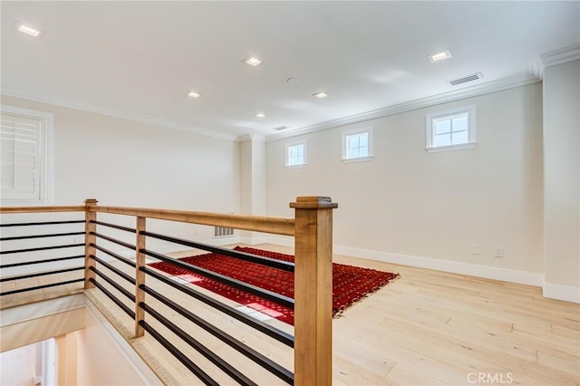 interior space featuring ornamental molding and hardwood / wood-style floors