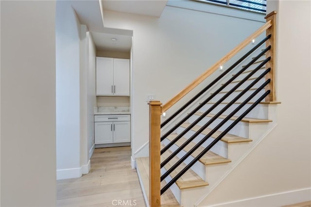 stairway with wood-type flooring