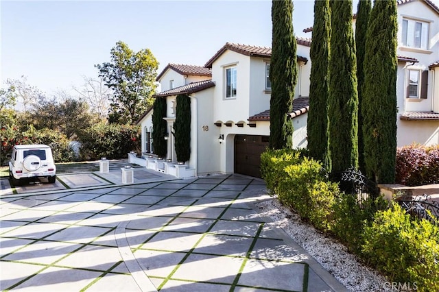 view of property exterior with a garage