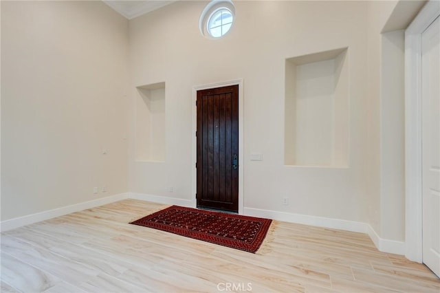 entrance foyer featuring crown molding