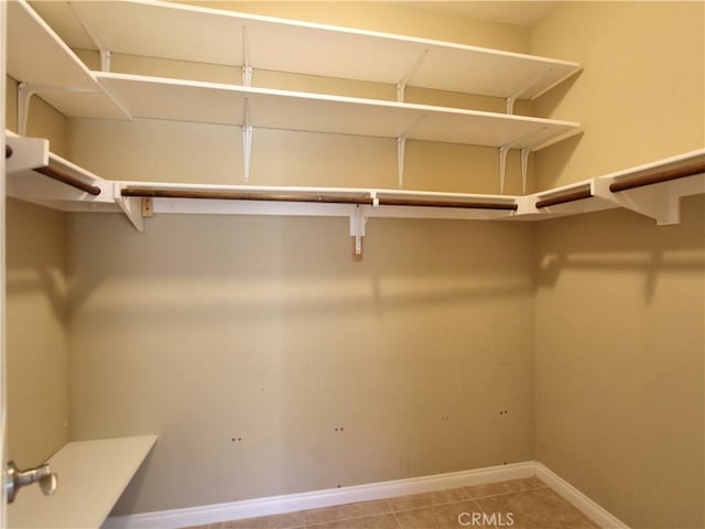 spacious closet with tile patterned flooring