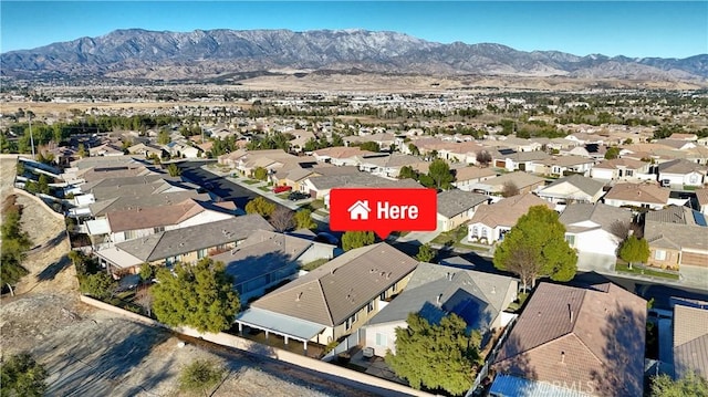 birds eye view of property featuring a mountain view