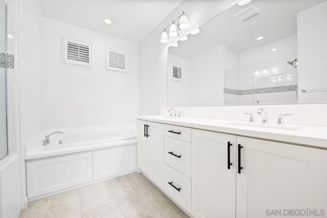 bathroom with separate shower and tub and vanity