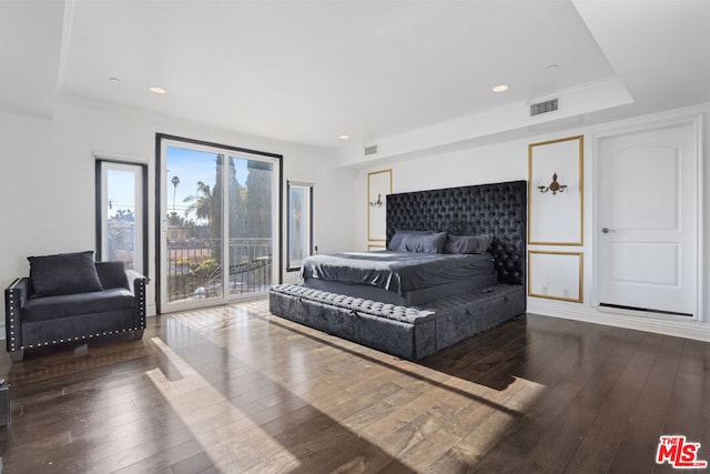 bedroom with dark wood-type flooring and access to outside