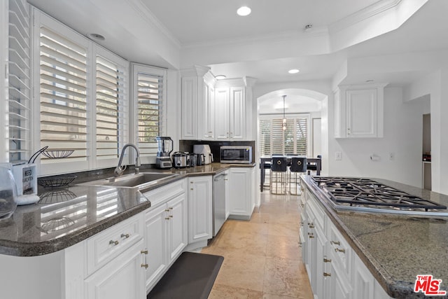 kitchen featuring sink, white cabinets, and stainless steel appliances