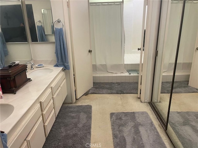 bathroom with a shower and vanity