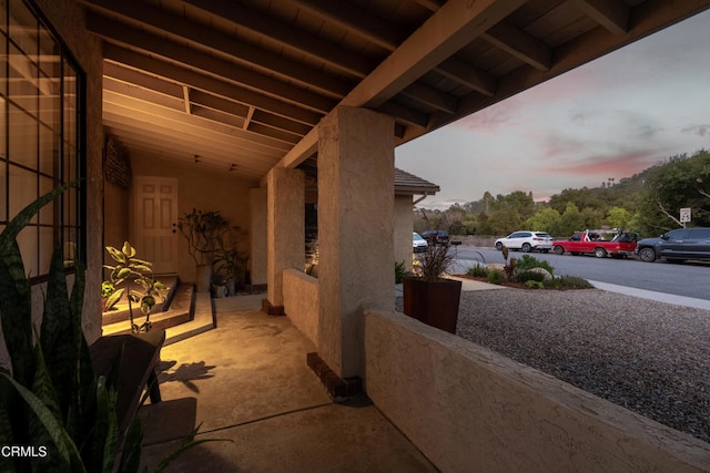 view of patio terrace at dusk