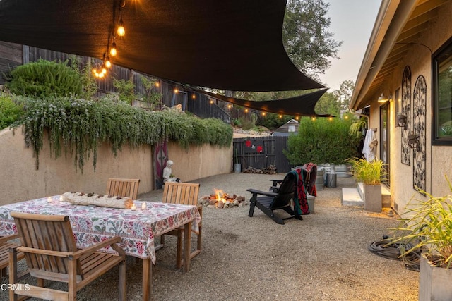 view of patio terrace at dusk