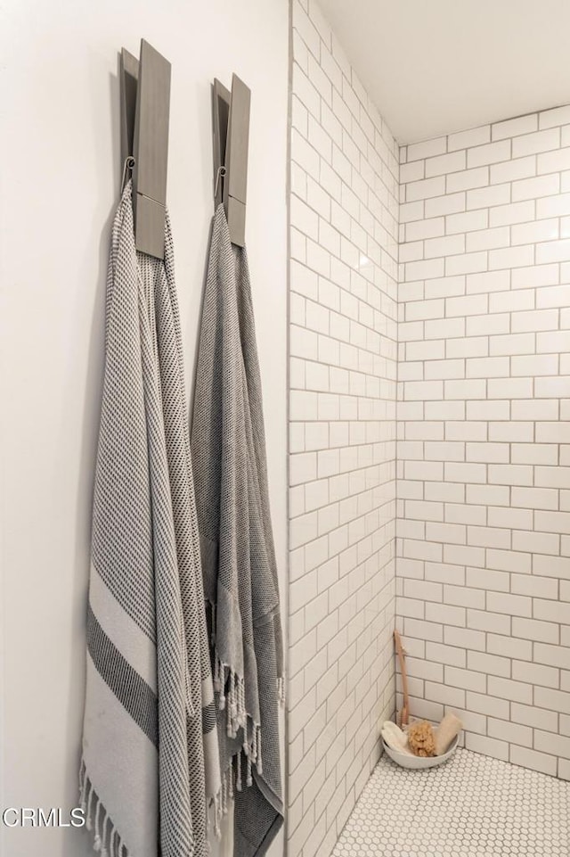 bathroom with a tile shower