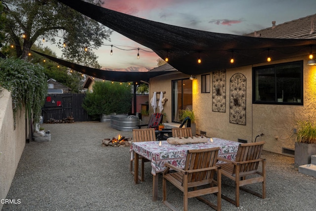 view of patio terrace at dusk