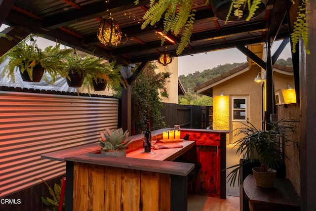 patio terrace at dusk with a bar