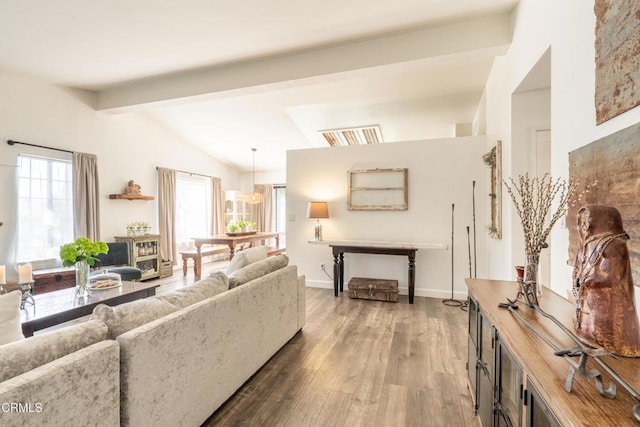 living area with lofted ceiling with beams, dark wood-style floors, and baseboards
