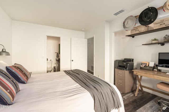 bedroom featuring wood finished floors and visible vents