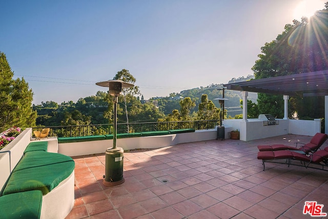 view of patio featuring a pergola and area for grilling