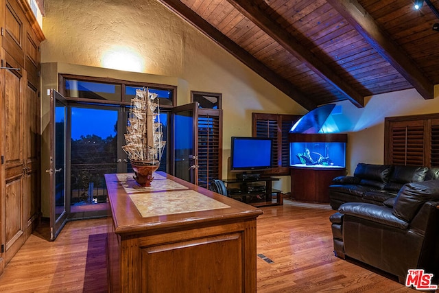 home office with vaulted ceiling with beams, light wood-type flooring, and wooden ceiling