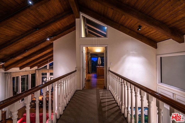 hallway with wooden ceiling and lofted ceiling with beams