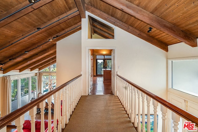 hall with high vaulted ceiling, wooden ceiling, and beam ceiling