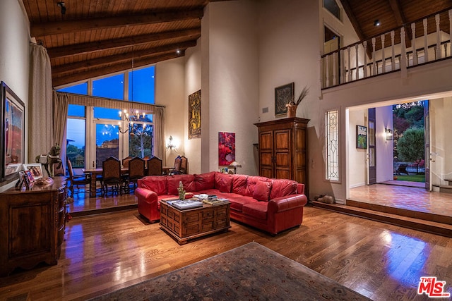 living room featuring a notable chandelier, wood ceiling, wood-type flooring, and high vaulted ceiling