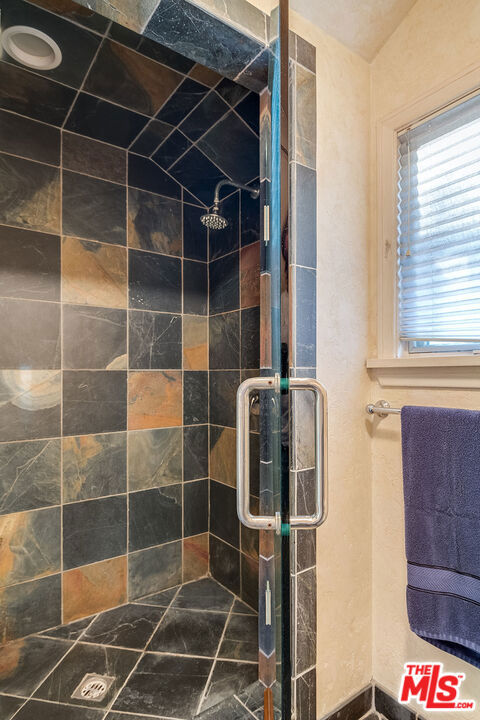 bathroom with an enclosed shower