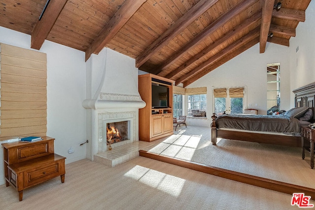 carpeted bedroom featuring high vaulted ceiling, wooden ceiling, beamed ceiling, and a fireplace