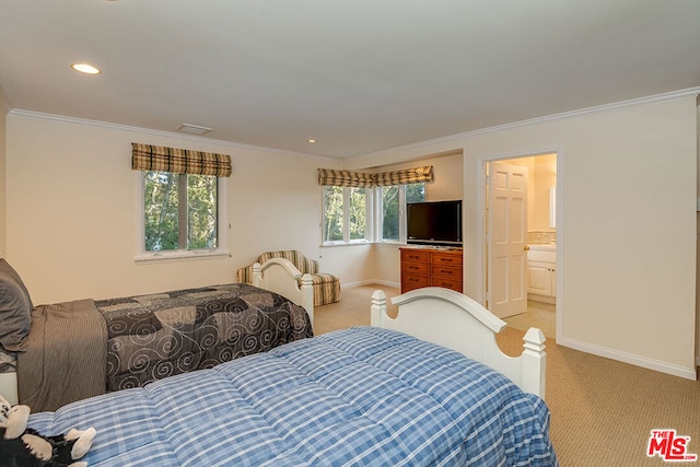 bedroom featuring multiple windows, ensuite bath, ornamental molding, and light carpet