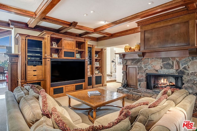 living room featuring beam ceiling, a stone fireplace, and coffered ceiling