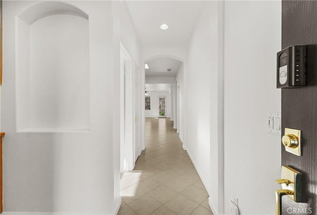 hall with light tile patterned flooring