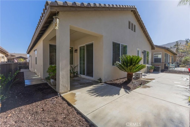 back of property featuring a patio