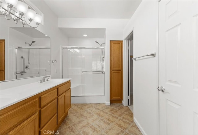 bathroom with vanity and an enclosed shower