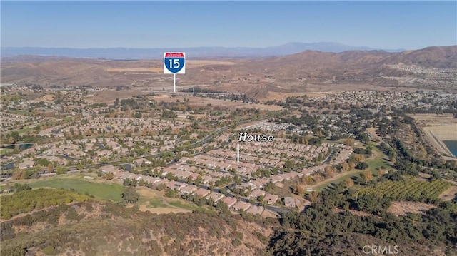 birds eye view of property featuring a mountain view